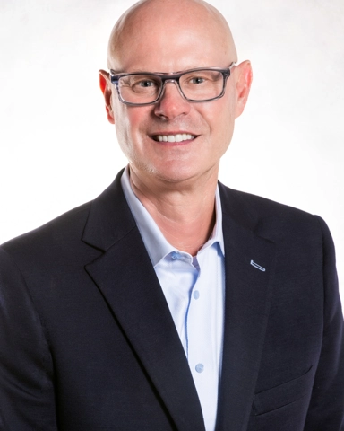 smiling person in professional attire
